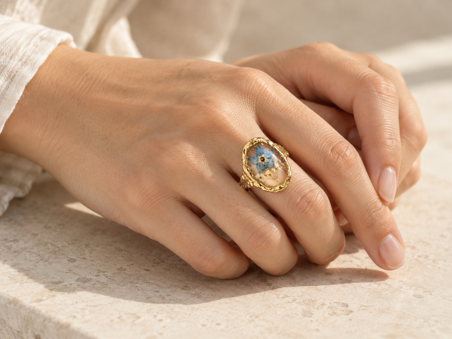 Botanical ring worn on a hand