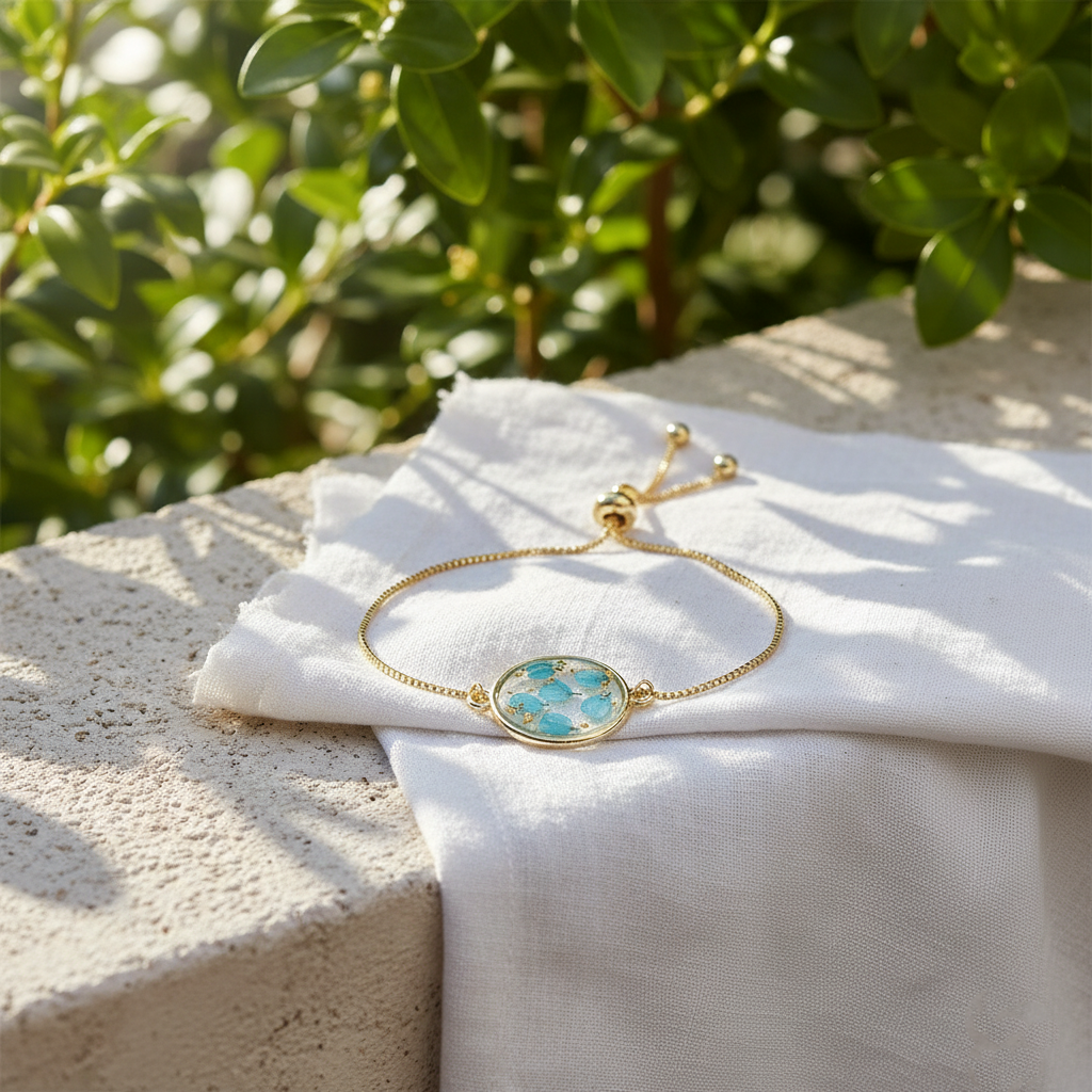 gold adjustable bracelet with blue pressed flower charm gold adjustable bracelet with blue pressed flower charm