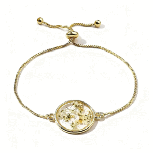 elegant gold bracelet with white floral glass charm