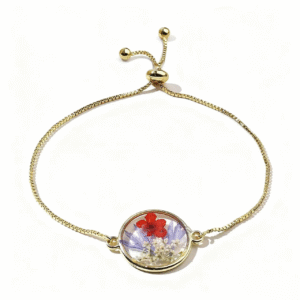 gold adjustable bracelet with colorful pressed flower charm