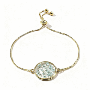 delicate gold bracelet with blue floral glass charm