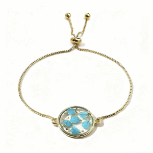 gold adjustable bracelet with blue pressed flower charm
