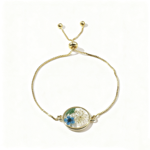 gold adjustable bracelet with pressed flower charm