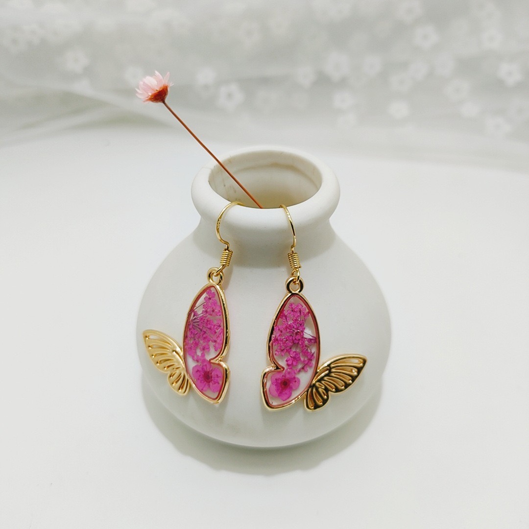 Pink pressed flower butterfly drop earrings