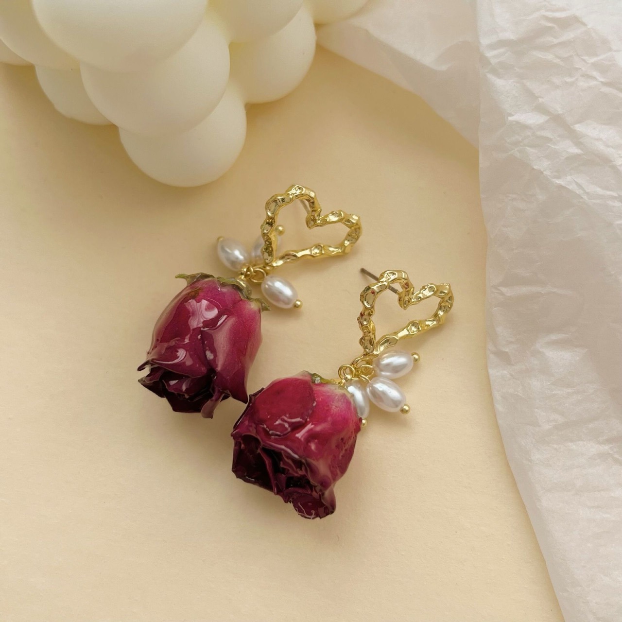 Preserved dried rose bud and pearl heart earrings detail